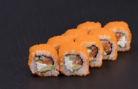 Sushi Rolls Sunny Philadelphia with RICE, SALMON, CUCUMBER, AVOCADO, CREAM CHEESE.の写真素材