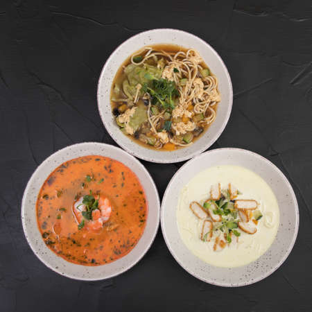 Wok soup set, on a black background.の写真素材