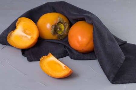 Sliced persimmon, Ripe orange persimmon fruit. Close up persimmon.の写真素材