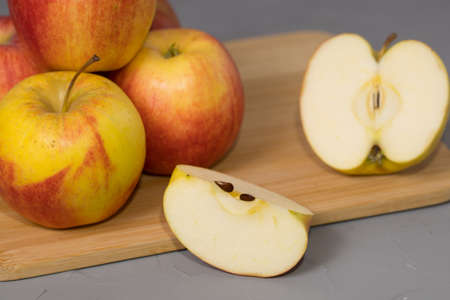 Fresh sliced apple on a wooden desk.の写真素材