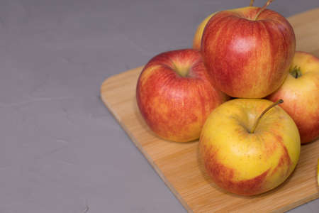 Fresh apple on a wooden desk.の写真素材