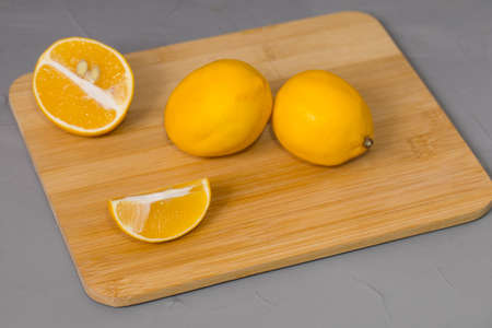 Fresh lemon on a wooden table.の写真素材
