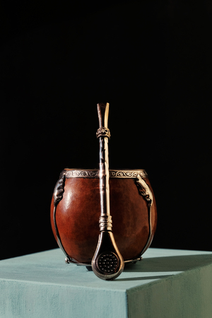 Beautiful calabash and bombilla on a dark backgroundの写真素材