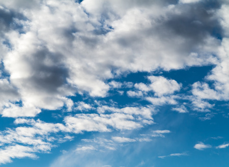 Soft white clouds against blue skyの写真素材
