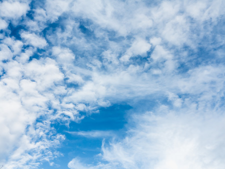 Soft white clouds against blue skyの写真素材