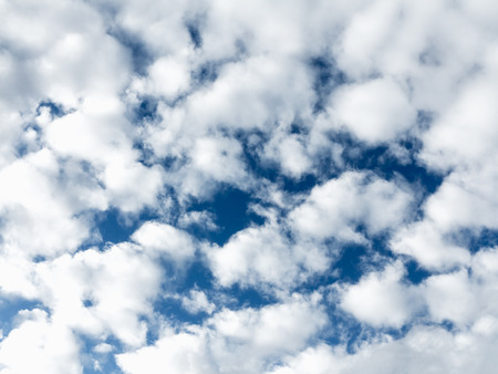 Soft white clouds against blue skyの写真素材