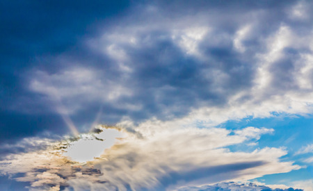 Soft white clouds against blue skyの写真素材