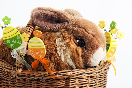 Easter rabbit with decorative eggs in the basketの写真素材