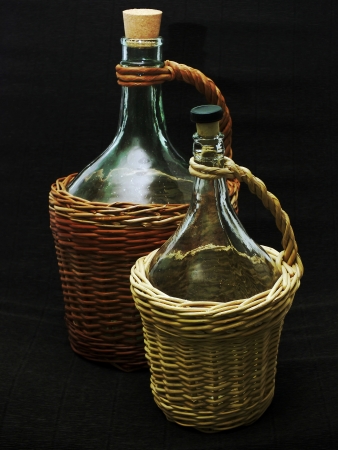 Two empty bottles on the dark background