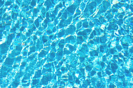 Surface of blue water in the pool, top view. Copy space. Template for your design.の写真素材