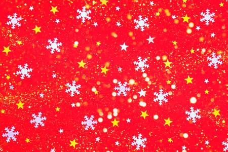 Perfect Christmas background. On a red background, gold and silver stars and snowflakes. Perfect for a postcard for the New Year.の写真素材