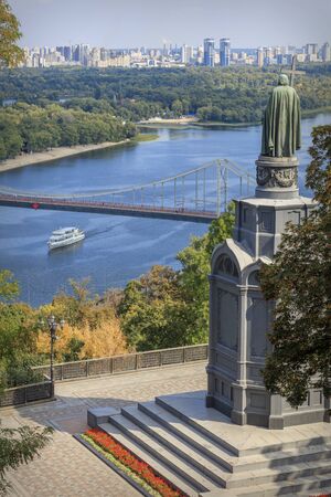 Beautiful top view of the monument to Prince Vladimir, the Dnieper, a pedestrian bridge and a ship....
