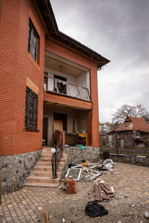 Bila Tserkva, Kyev region Ukraine - 03/04/2022: The consequences of an airstrike, a missile attack on residential buildings in Bila Tserkva. Russian troops destroy houses, people in Ukraine.のeditorial素材