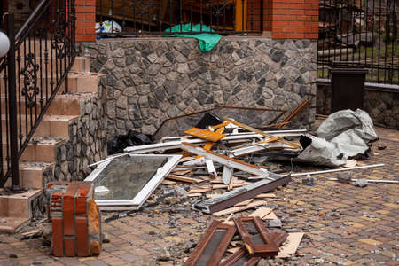 Bila Tserkva, Kyev region Ukraine - 03/04/2022: The consequences of an airstrike, a missile attack on residential buildings in Bila Tserkva. Russian troops destroy houses, people in Ukraine.のeditorial素材