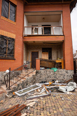 Bila Tserkva, Kyev region Ukraine - 03/04/2022: The consequences of an airstrike, a missile attack on residential buildings in Bila Tserkva. Russian troops destroy houses, people in Ukraine.のeditorial素材