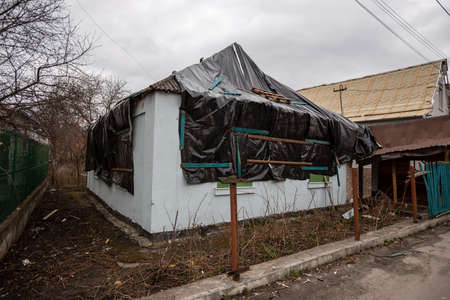 Bila Tserkva, Kyev region Ukraine - 03/04/2022: The consequences of an airstrike, a missile attack on residential buildings in Bila Tserkva. Russian troops destroy houses, people in Ukraine.のeditorial素材