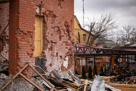 Bila Tserkva, Kyev region Ukraine - 03/04/2022: The consequences of an airstrike, a missile attack on residential buildings in Bila Tserkva. Russian troops destroy houses, people in Ukraine.のeditorial素材