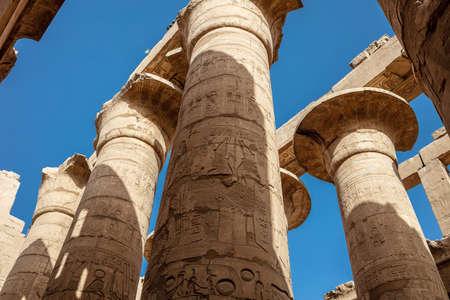 Different columns with hieroglyphs in Karnak temple. Karnak temple is the largest complex in ancient...