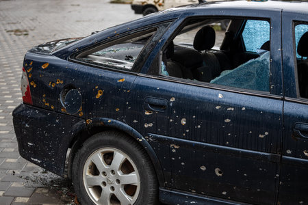 Irpin, Kyev region Ukraine - 04/09/2022: Cities of Ukraine after the Russian occupation. On the streets of Irpin. Shot cars. Irpin, Bucha, Gostomel.のeditorial素材