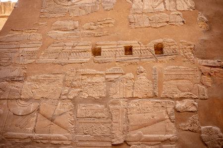 Different hieroglyphs on the walls and columns in the Karnak temple. Karnak temple is the largest...