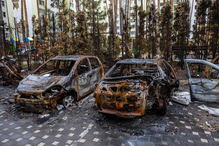 Irpin, Kyev region Ukraine - 04/09/2022: Cities of Ukraine after the Russian occupation. Cars burned down on the street. Irpin, Bucha, Gostomel.のeditorial素材