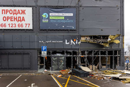 Hostomel, Kiev region Ukraine - 04/09/2022: Outside the store, which was bombed, was looted by Russian soldiers, occupiers. The looters destroyed the shop.のeditorial素材