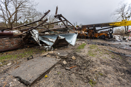 Irpin, Kyev region Ukraine - 04/09/2022: Cities of Ukraine after the Russian occupation. Destroyed military equipment on the streets of the city. Lots of burnt and shelled vehicles.のeditorial素材