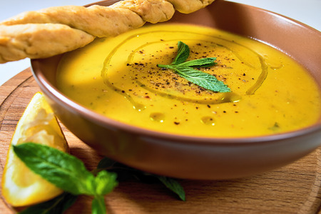 Turkish Traditional lentil cream soup with mint, lemon and homemade bread. Ezogelin.の写真素材