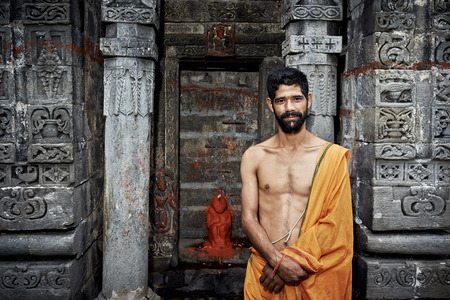 Naggar, INDIA - JULY 17: Indian Young brahmin stands near the temple of Krishna. July 17, 2013 in Naggar, Kullu Valley, Himachal Pradesh, India.のeditorial素材