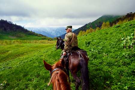 Krasnodar, RUSSIA - July 17, 2015: Huntsman is a horse in the mountains.のeditorial素材