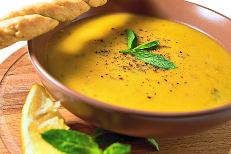 Turkish Traditional lentil cream soup with mint, lemon and homemade bread. Ezogelin.の写真素材