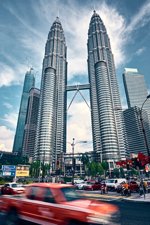 Kuala Lumpur, Malaysia â November 2017. Petronas Twin Towers, with blured car on foreground.のeditorial素材