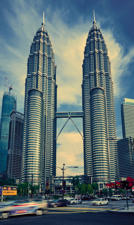 Kuala Lumpur, Malaysia - November 20, 2017. Petronas Twin Towers. Skyscrapers view from street level, with blue sky on background. Image with place for textのeditorial素材