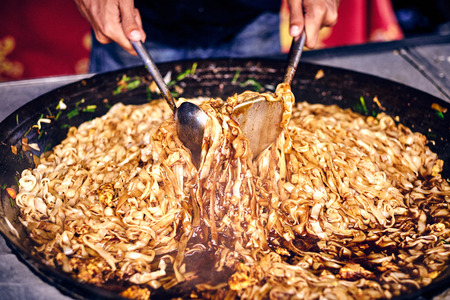 Fried noodles in a wok. Asian, Indian and Chinese street food. Food court on local market of Langkawi island, Malaysia.
Traditional asian street food.の写真素材