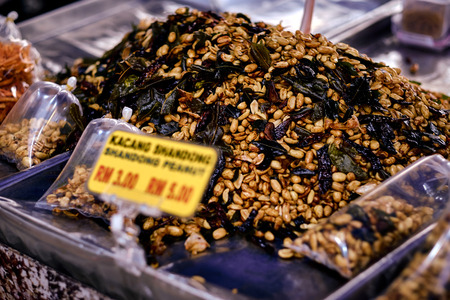 Fried peanut with chilly pepper - traditional asian street food. Asian, Indian and Chinese street food. Food court on local market of Langkawi island, Malaysia.の写真素材