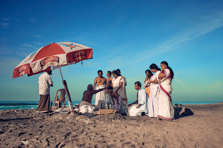 Varkala, Kerala, India - Nov 30, 2017: Varkala beach. Peoples come to brahmanas for perform puja and...