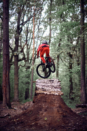 Moscow, Russia - October 07, 2018: Jump and fly on a mountain bike. Rider in action at mountain bike sport. Biker riding in nature. Cool athlete cyclist on a bike. MTB biking.のeditorial素材