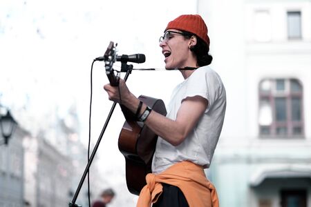 Moscow, Russia - Aug 27, 2019: Famous street singer named Pappillio give concert in the center of...