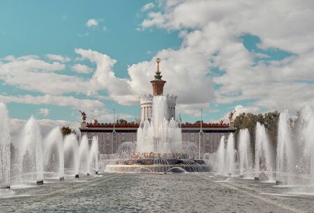 Moscow, Russia - Aug 27, 2019: Fountain Stone Flower and Ukraine Pavilion on blue sky and clouds background panoramic view, summer sunny day, Exhibition of Achievements of National Economy VDNKhのeditorial素材