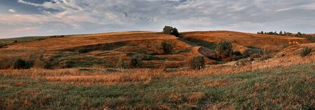 Panoramic landscape of central Russia agricultural countryside with hills. Summer landscape of the Samara valleys. Russian countryside. High resolution file for large format printing.の写真素材