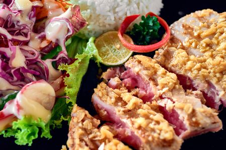 Grilled tuna steak with rice and vegetables. Close up.の写真素材