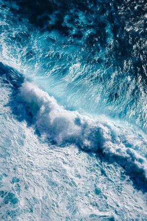 Aerial view to waves in ocean Splashing Waves. Blue clean wavy sea water.の写真素材