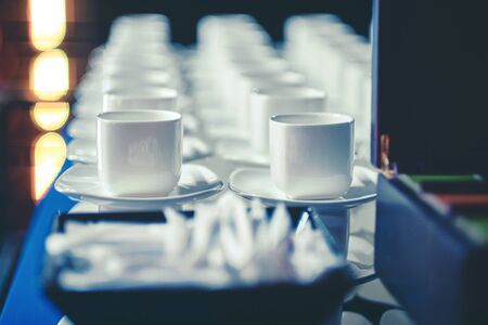Coffee break at conference meeting. Empty coffee or tea cup at cafe bar.の写真素材