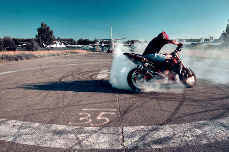 Moscow, Russia - Jul 13, 2020: Moto rider making a wheels burn on his motorbike. Stunt motorcycle...