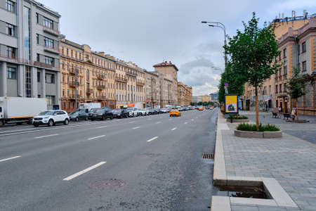 Moscow, Russia - Jul 2020: General landscape view at tradition Moscow architecture. City life on the main streets of the city. The citizens go on their own business. Automobile traffic.のeditorial素材