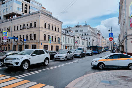 Moscow, Russia - Jul 2020: General landscape view at tradition Moscow architecture. City life on the main streets of the city. The citizens go on their own business. Automobile traffic.のeditorial素材