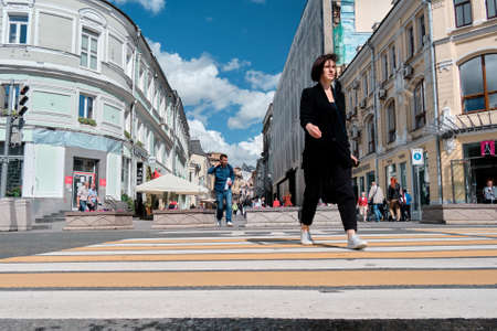 Moscow, Russia - 23 Jul 2020: General landscape view at tradition Moscow architecture. City life on the central streets of the city. The citizens go on their own business. Automobile traffic.のeditorial素材