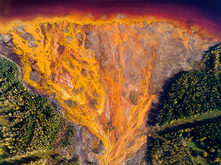 Aerial shot of pollution by toxic waste flowed to the surface and destroys forests and lakesの写真素材