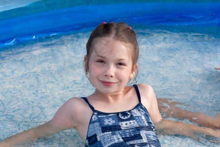 portrait of the little girl in swimming pool の写真素材