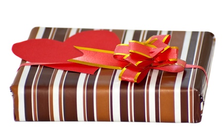 striped box with ribbon and heart shaped paper note for text の写真素材